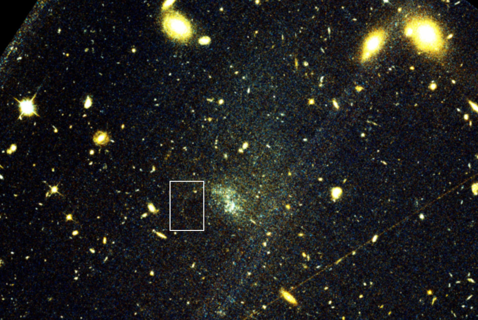 A Stream of Stars Illuminates Dark Matter in a Distant Galaxy